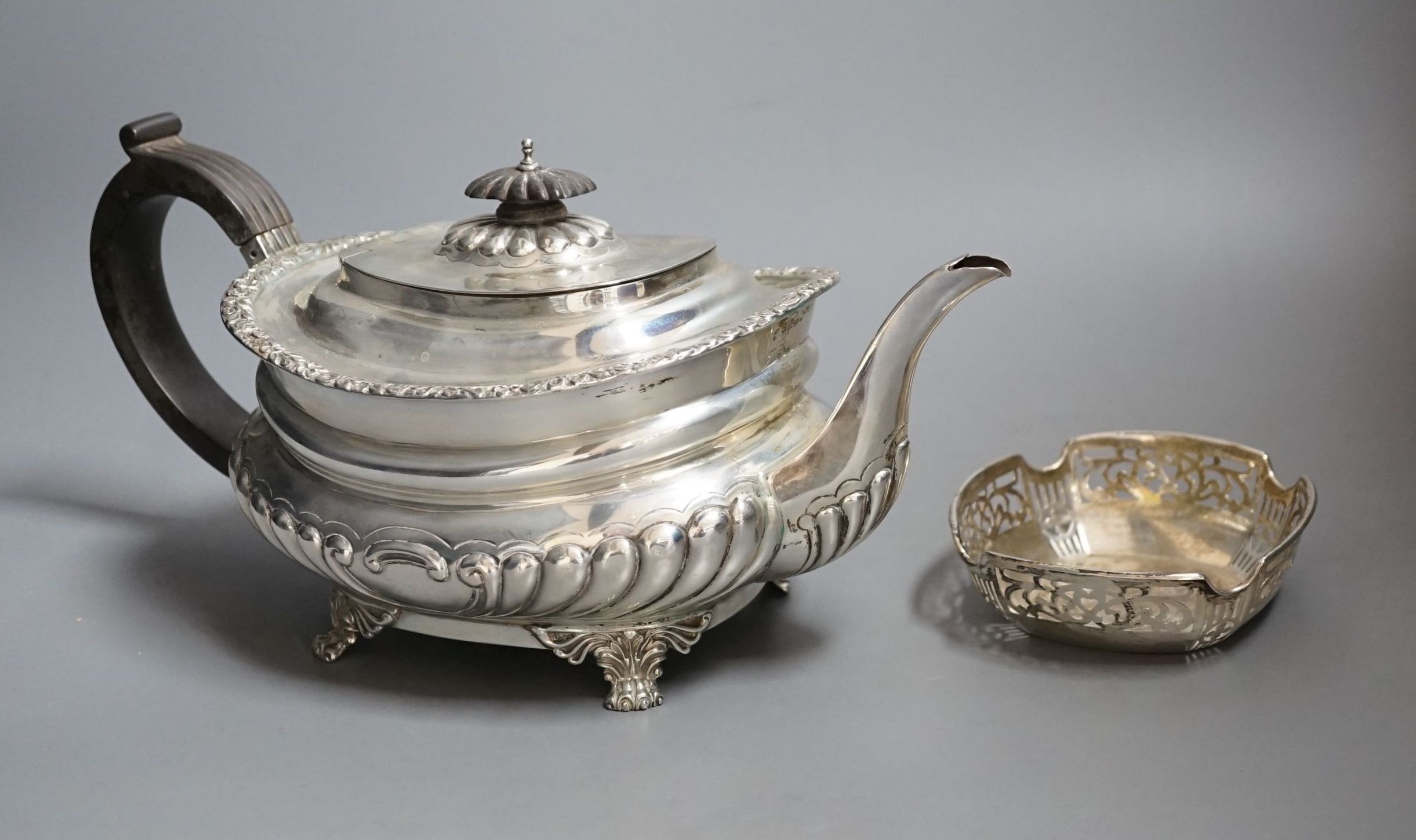 A George V demi-fluted silver teapot, by Charles Stuart Harris & Sons, London, 1928 and a small silver dish